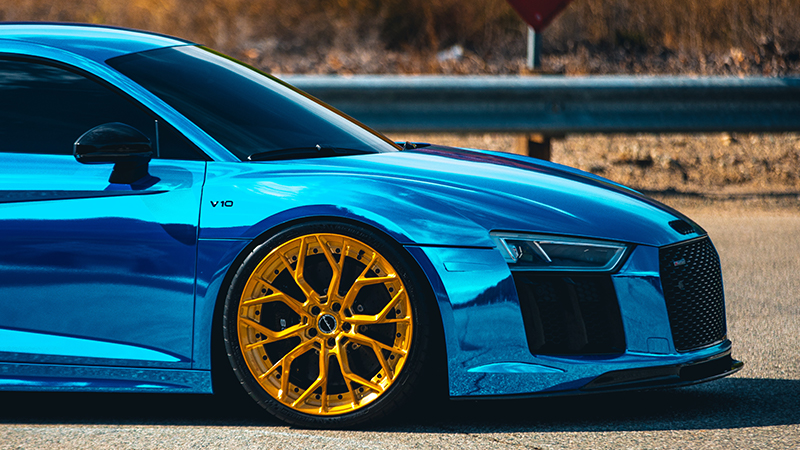 blue BMW with gold rims