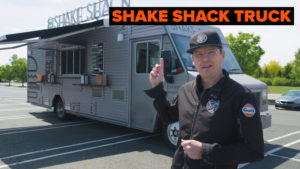 Zac standing in front of a shake shack truck