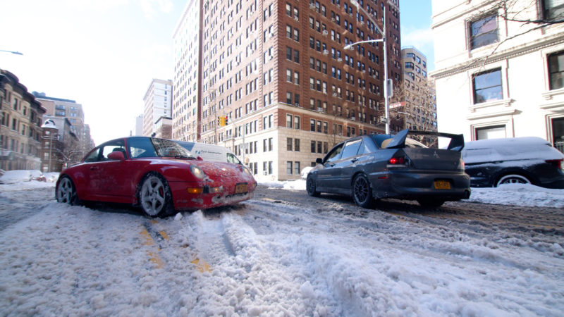 cars parked on the streets in the snow