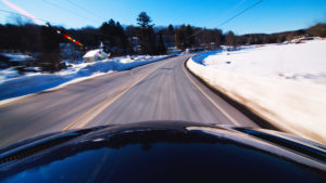 car driving down a snowy road